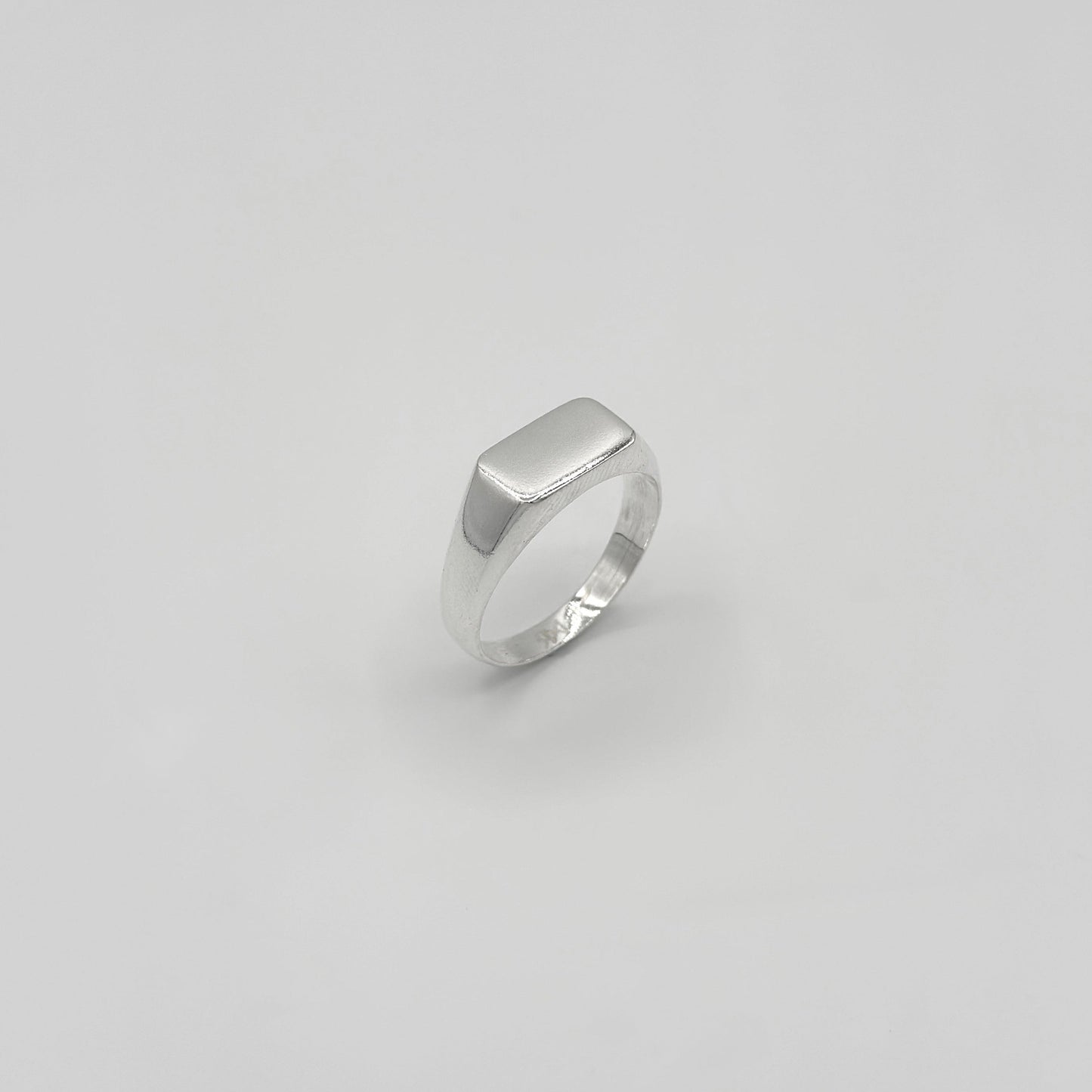Silver ring on a white background