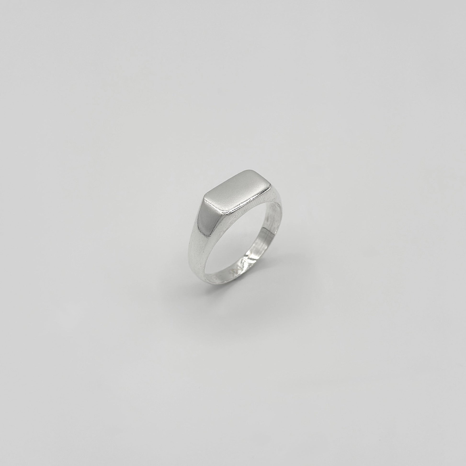 Silver ring on a white background