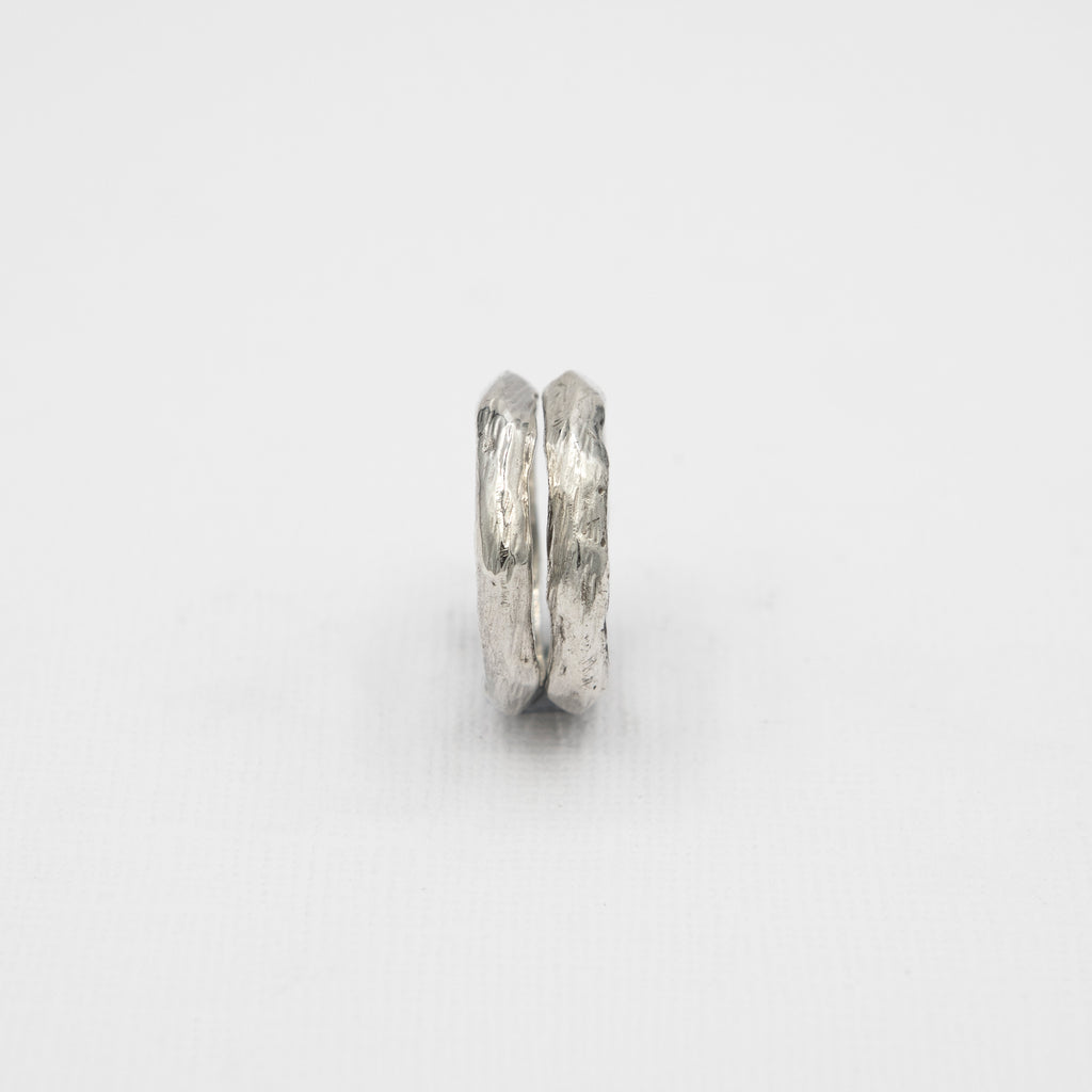 A sleek and minimalist men's stacking ring in solid 925 silver, perfect for surf-inspired style and layering.