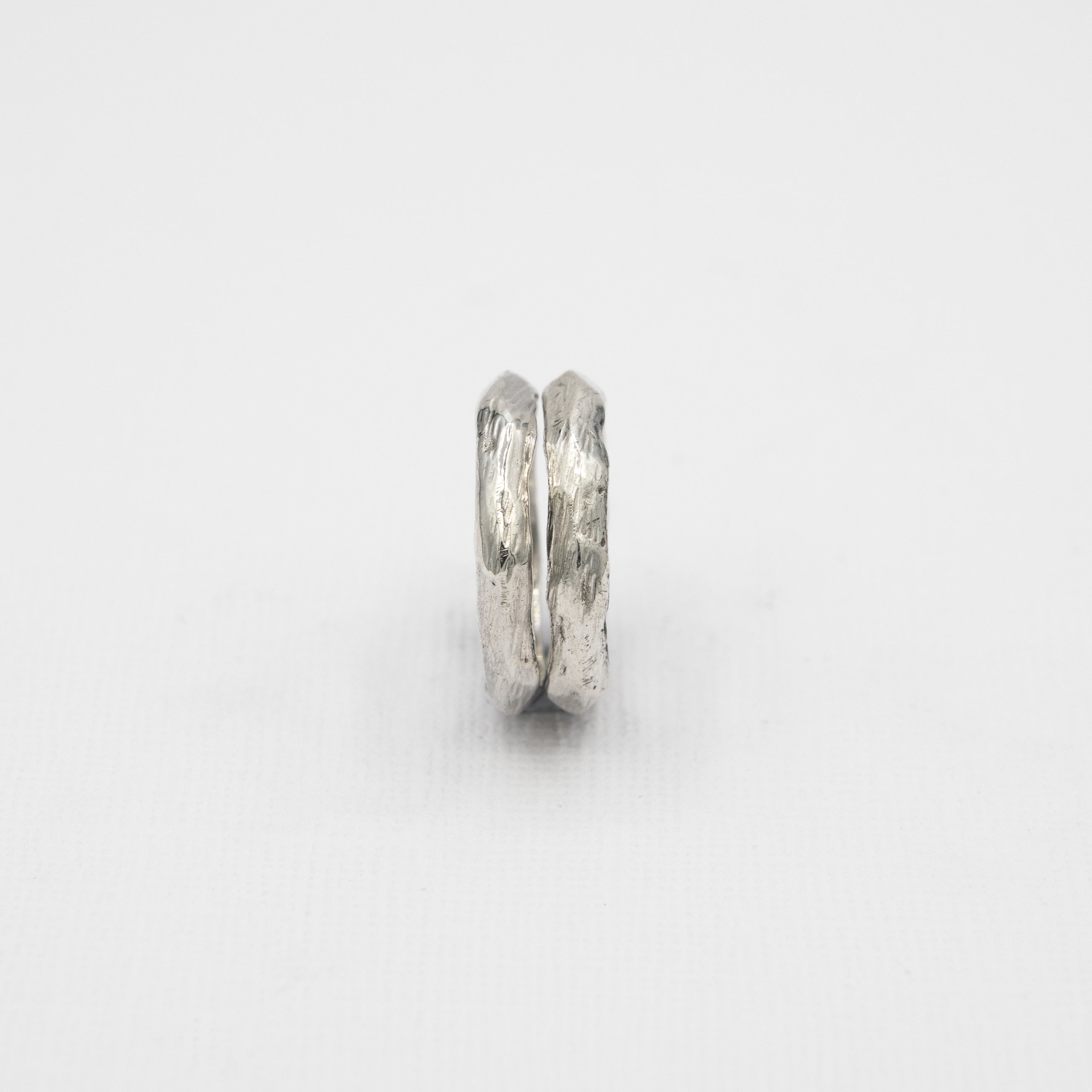A sleek and minimalist men's stacking ring in solid 925 silver, perfect for surf-inspired style and layering.