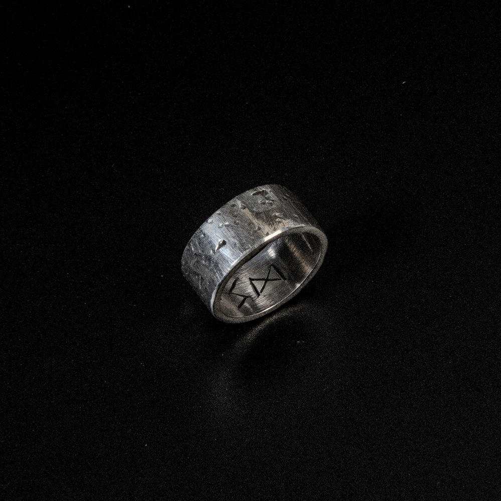 A bold yet minimal sterling silver ring for men who embrace the spirit of adventure.