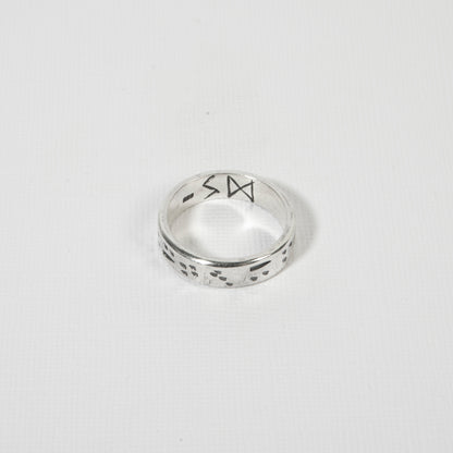 Minimalist yet bold men’s sterling silver surf ring, perfect for ocean lovers and adventurers.