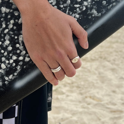 Designed for versatility, this Australian surf lifestyle-inspired stacker ring is a staple in men’s silver jewelry